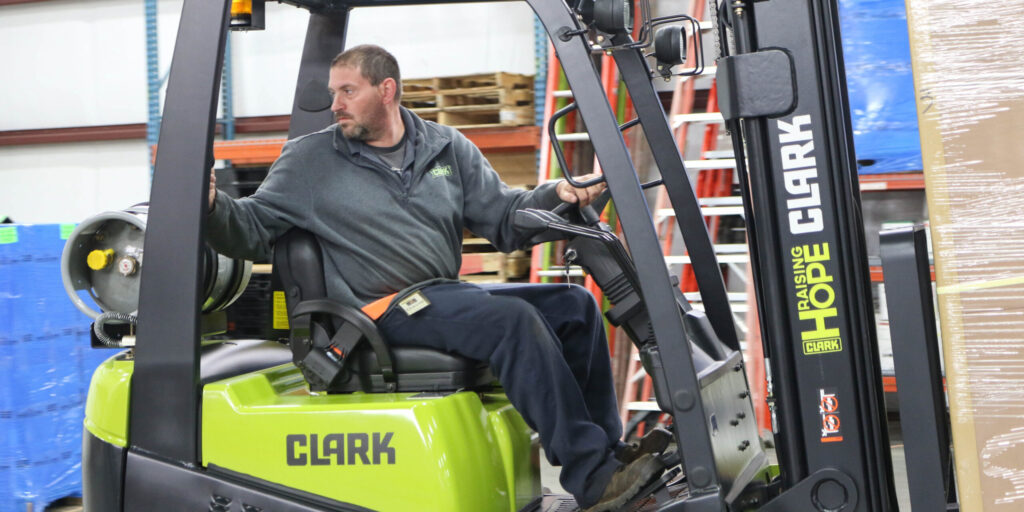 Man reversing a Clark Forklift